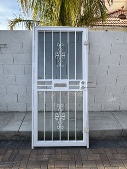 Grisham 36in x 80in Storm Security Door White- Sturdy Steel Frame And Tampered Glass- Reversible For Left And Right Hinging 