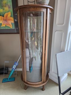 Round Wood Curio with curved glass
3 glass shelves 
23" x 23" x 56"h