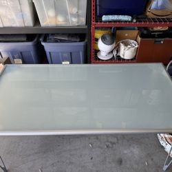 Glass Table - Good Condition -   31” Deep x 62” Long x 29” Tall  Pick up only. Cash only. Val Vista and Pecos