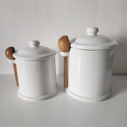 vintage white ceramic kitchen canisters w/ wood spoon scoops