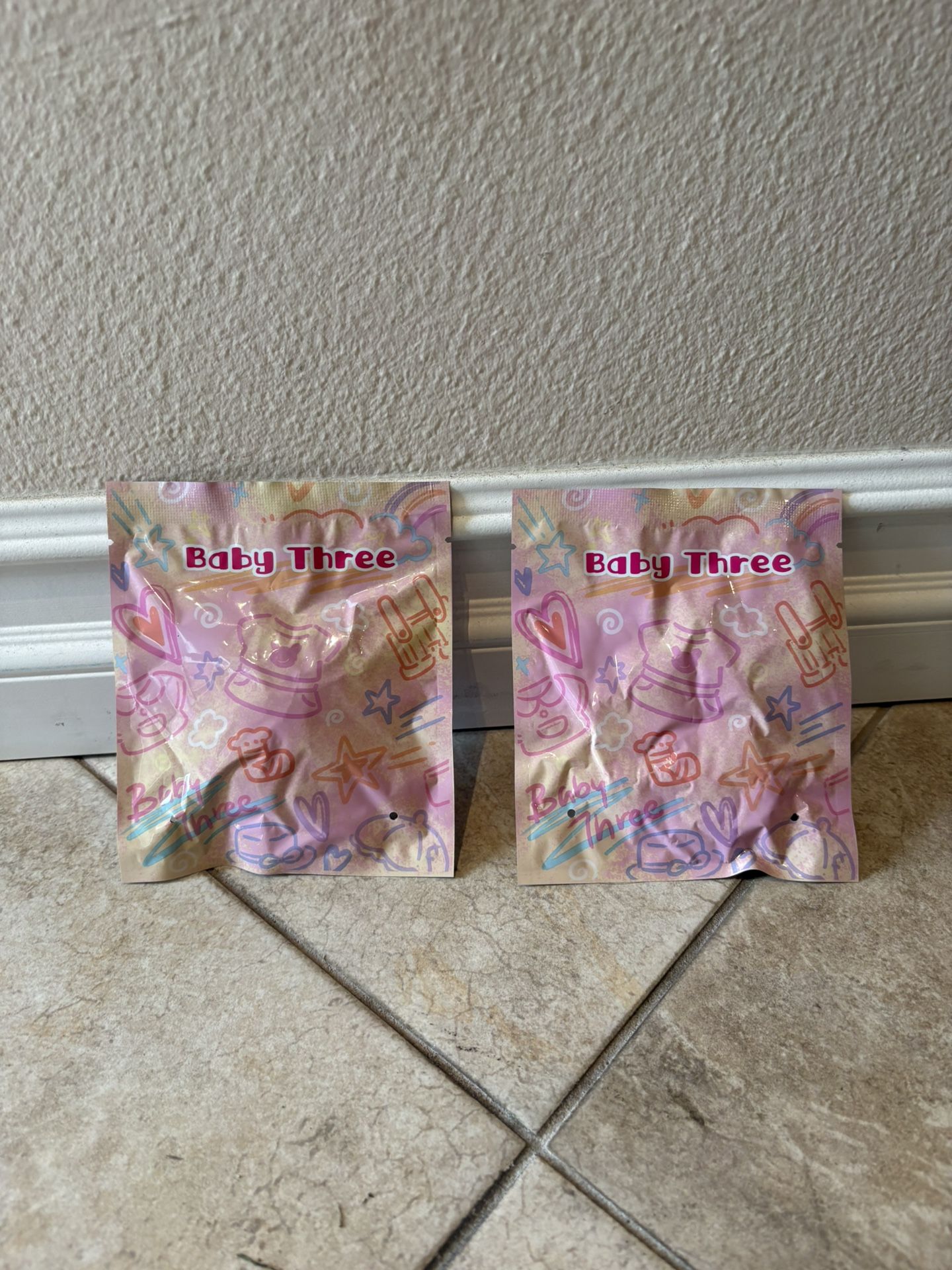 2 Baby Three clothes blind bag.