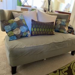 Small Green Sofa with Pillows