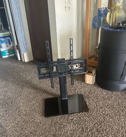 Black TV stand with adjustable mount. hardware included.