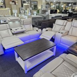 Brand New Biege Synthetic Leather Motorized Reclining Sofa + Loveseat With Power Headrests, Wireless Charging, Cup Holders, Storage, And Blue LED