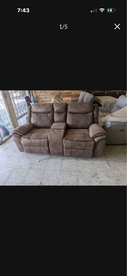 Brown Reclining Loveseat with Console and Cup Holders