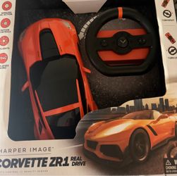 Sharper Image RC Chevrolet Corvette ZR1, a 1:16 scale remote-control sports car featuring gravity-sensor steering via a handheld steering