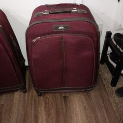 2 Almost New Samsonite Roll And Turn Suitcases