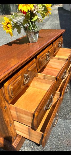 Vintage solid pecan long dresser with big drawers. Drawer working well . Delivery available