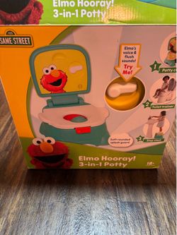 Brand new Sesame Street Elmo 3 in 1 potty  training chair with sounds