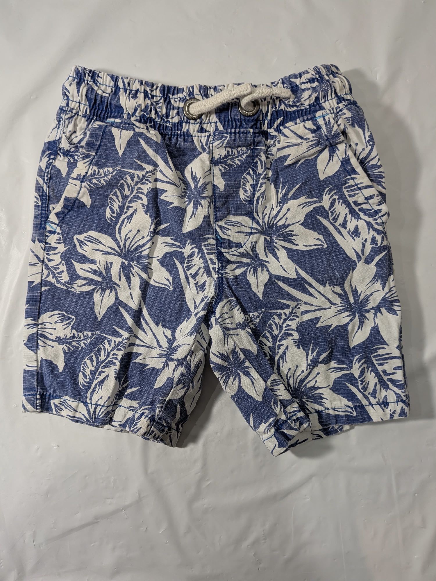 NEXT shorts with a blue and white floral print. Boys Size 5t.