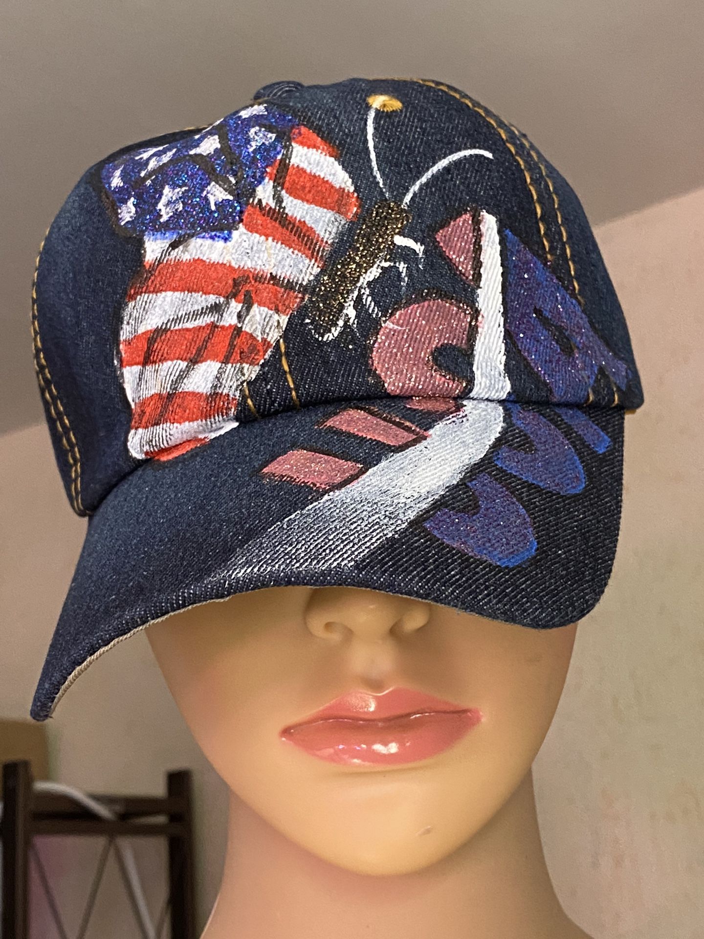STYLE #10-BUTTERFLY FLAG. CUTE HAT W/SEMI-BLING. SHINES IN THE LIGHT.