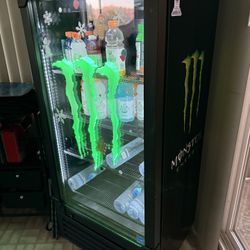 This is a Monster Energy branded mini fridge or cooler,