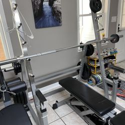 300 lbs INSPIRE Rubber Coated Olympic Weight Set With 7 Foot Bar + Spotting Rack With Bench