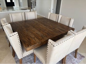 64” Square Wood Pedestal Dining Table and 8 Upholstered Wingback Chairs with Nail Head Trim