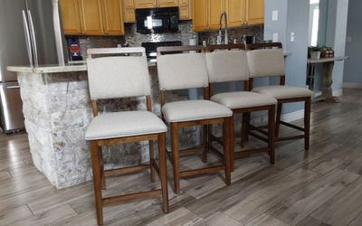 Four beautiful mid century counter height bar stools