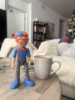 Blippi Talking Figure, 9-inch Articulated Toy with 8 Sounds and Phrases