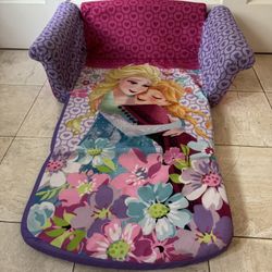 Purple and pink sofa with Frozen characters design.