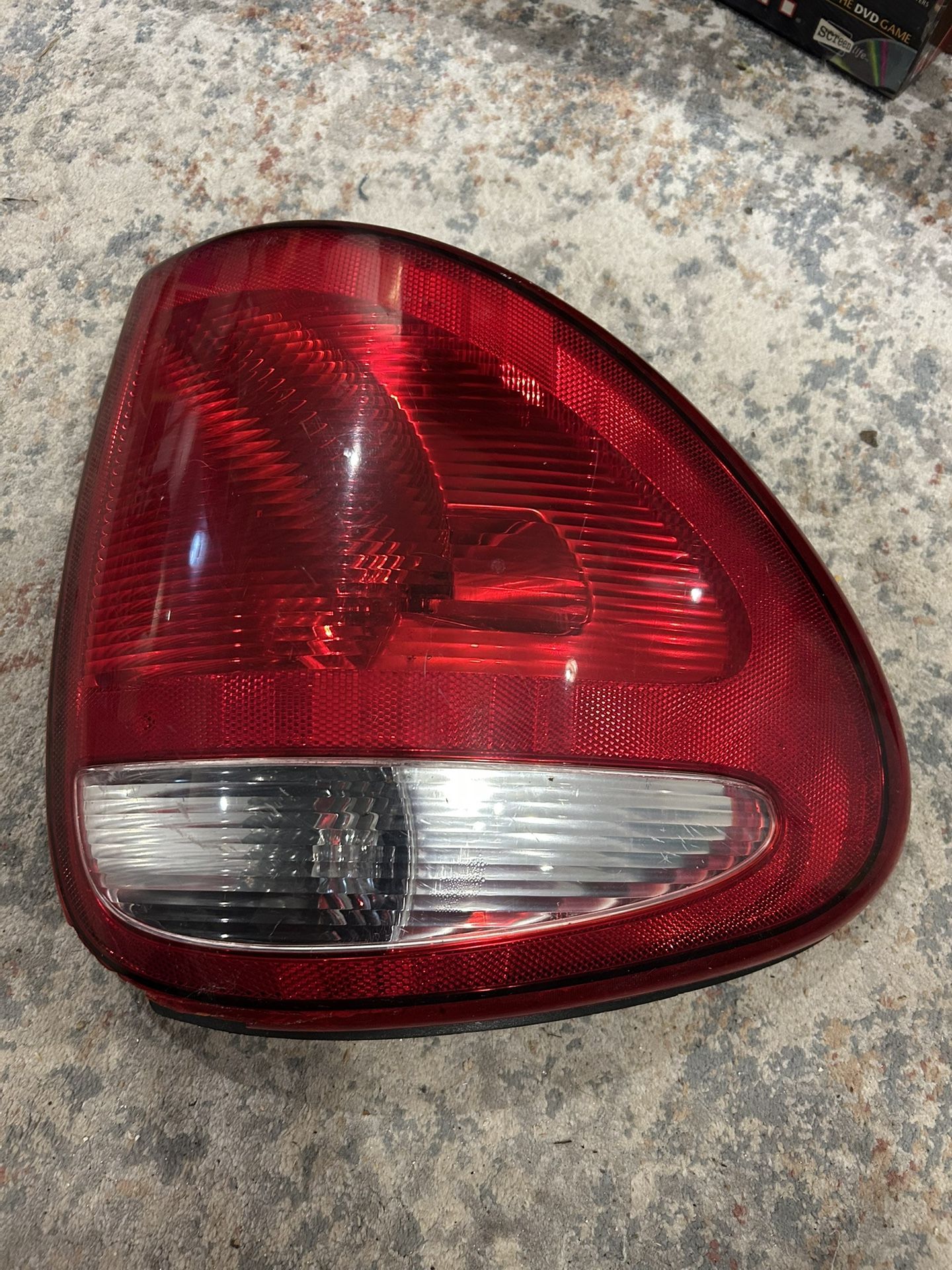 2004-2007 DODGE Caravan LEFT Rear Tail Light 19-04A-PM OEM (A7-25) Part of the red is chipped off at the bottom….very unnoticeable as this pa