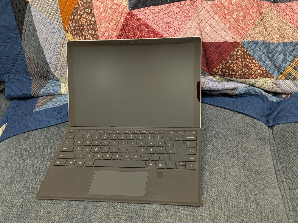 Microsoft Surface Pro 7+ with keyboard and charger
