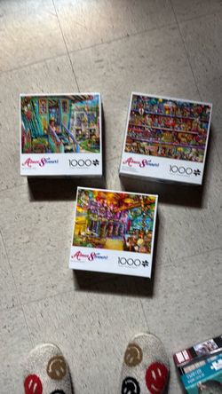 Aimee Stewart 1000-Piece Jigsaw Puzzles – $3 each