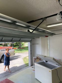 Door white flush with chamberlain opener,16x7 with installation including