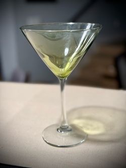 Martini glasses and storage case.  Green tops and clear stems/base