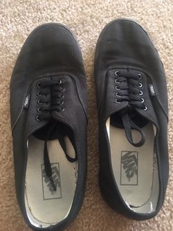 Black vans shoes and size 11.5