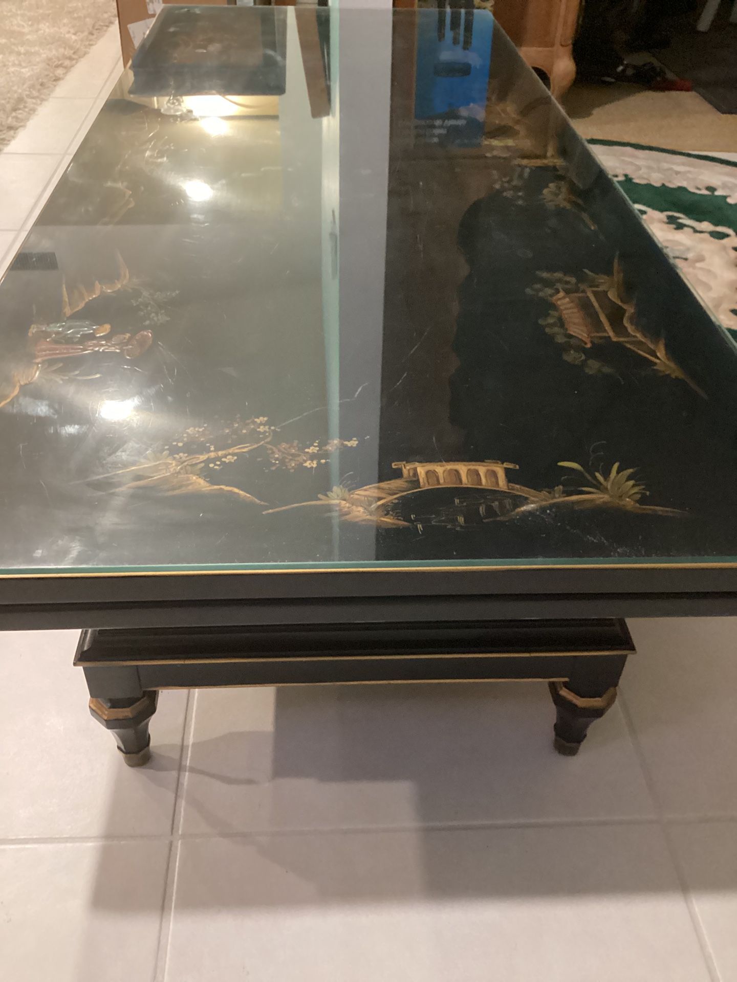 Long Oriental Designer Coffee Table With A Protective Glass Top Bottom Shelf In Good Condition Asking $400. Obo