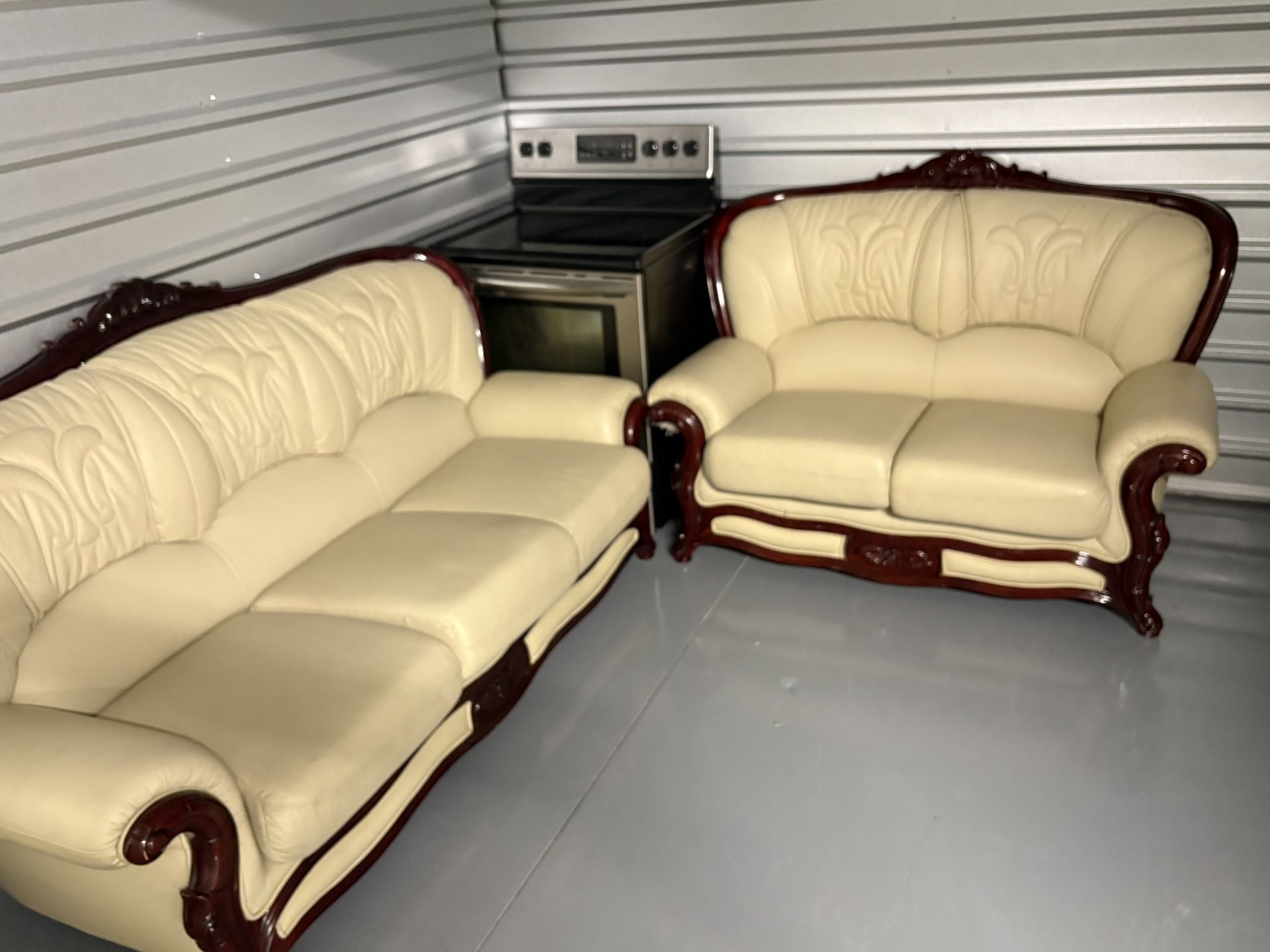 Cream Leather Sofa Set (Couch + Loveseat) With Carved Wood Trim