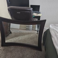 Hour glass shaped mirror