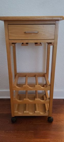 wooden wine rack features a natural finish and convenient caster wheels for mobility