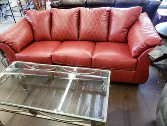 Red leather sofa with white stitching