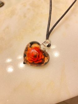 Real glass heart pendant with a flower inside