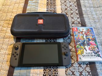 Nintendo Switch with Case and Super Smash Bros Ultimate