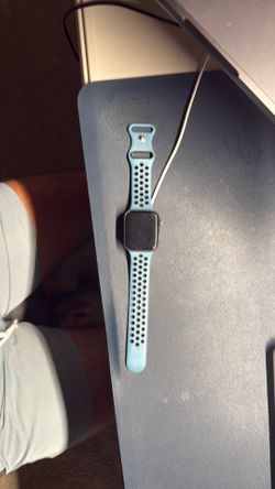 Apple Watch SE (44mm) with charger and sport strap