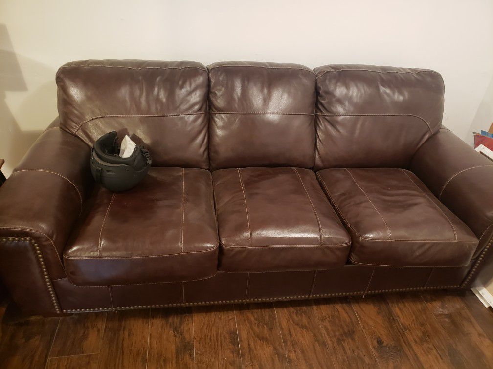Ashley leather sofa with pull out bed.