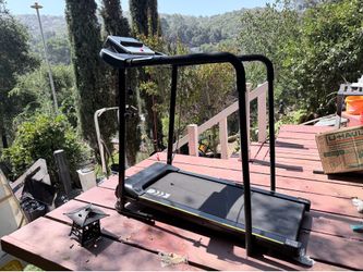 Treadmill with grab bars