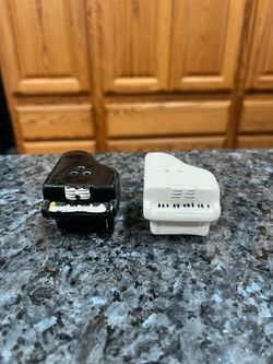Vintage Ceramic Black and White Piano Pair of Salt and Pepper Shakers.  Size approximately 1 1/2 inches tall.  Preowned some wear on the bottoms.  Nev