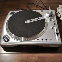 Numark turntable.  Never used.  Needle has never been attached to the arm.  Plays both 45 and 33.