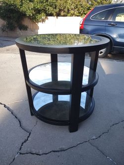 Uttermost three-tier round side table with mirrored glass shelves