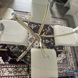 dining table with 4 chairs and two floor tables 