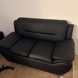 New black leather loveseat 