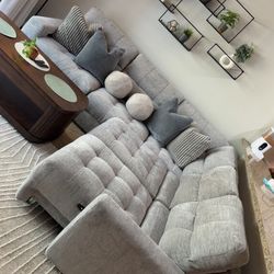 Gray fabric sectional, 2 weeks old