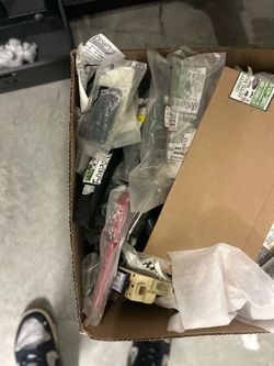A lot of aftermarket car parts box brackets, turn signals handles and more