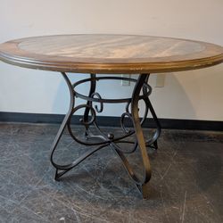 Round Stone Top Dining Table with Wood Trim and Metal Pedestal Base
