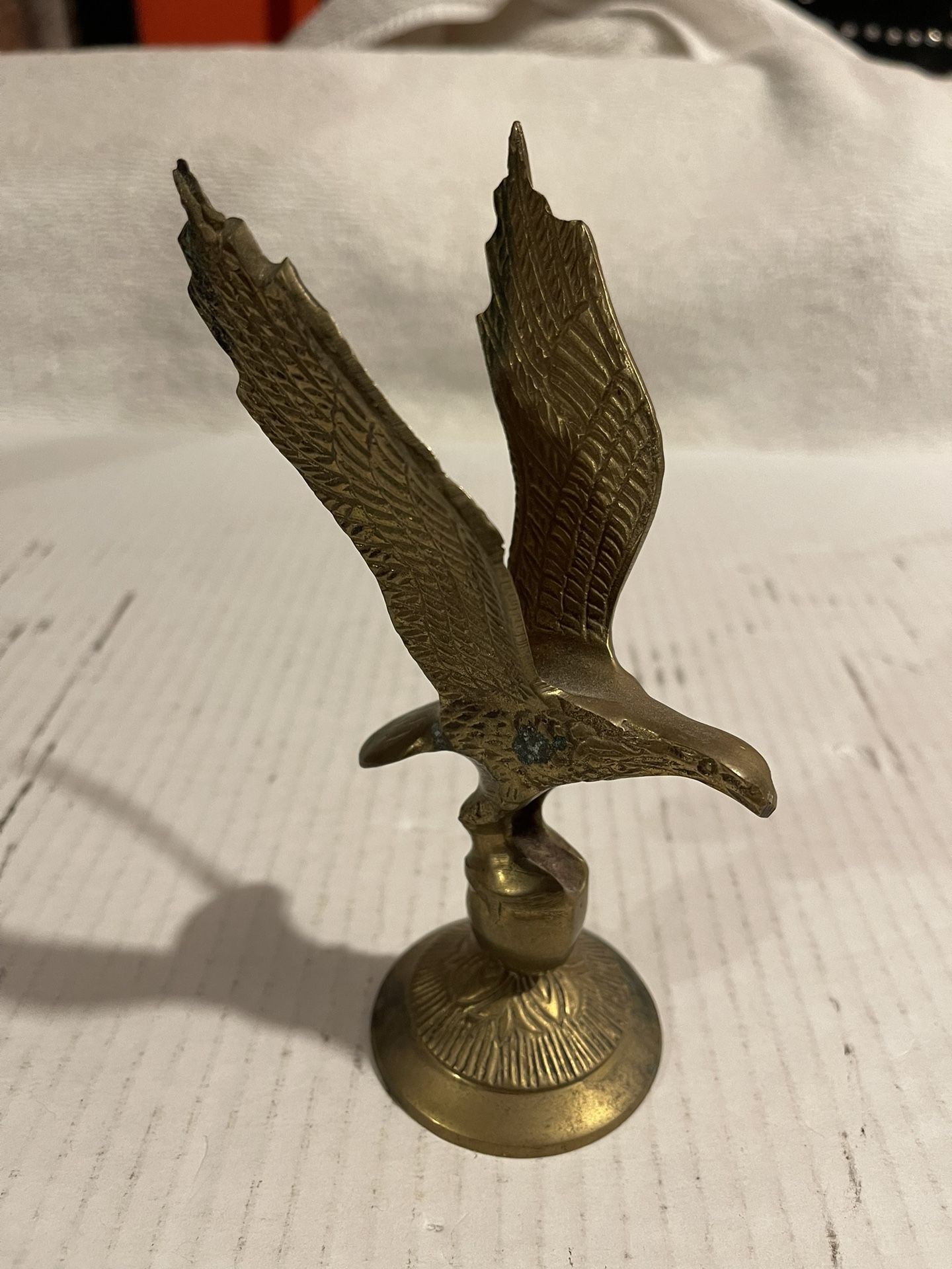BRASS  FLYING EAGLE ON A BALL