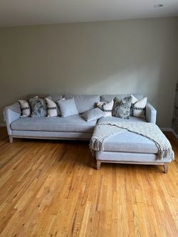 Grey L shaped sofa and ottoman