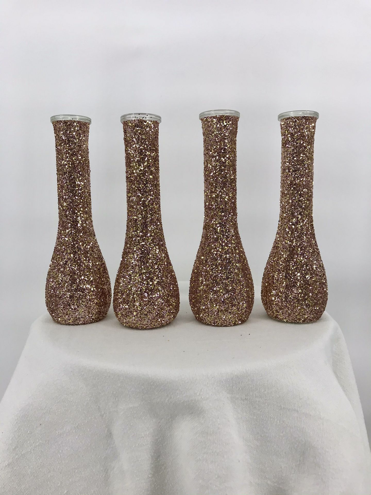 4 rose gold bud vases