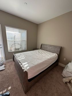 Bed with mattress and night stand