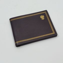 Vintage Italian Leather Bifold Wallet Gold Tooled Crest, Genuine 
Calfskin. Excellent vintage condition. The leather shows a beautiful 
natural patina